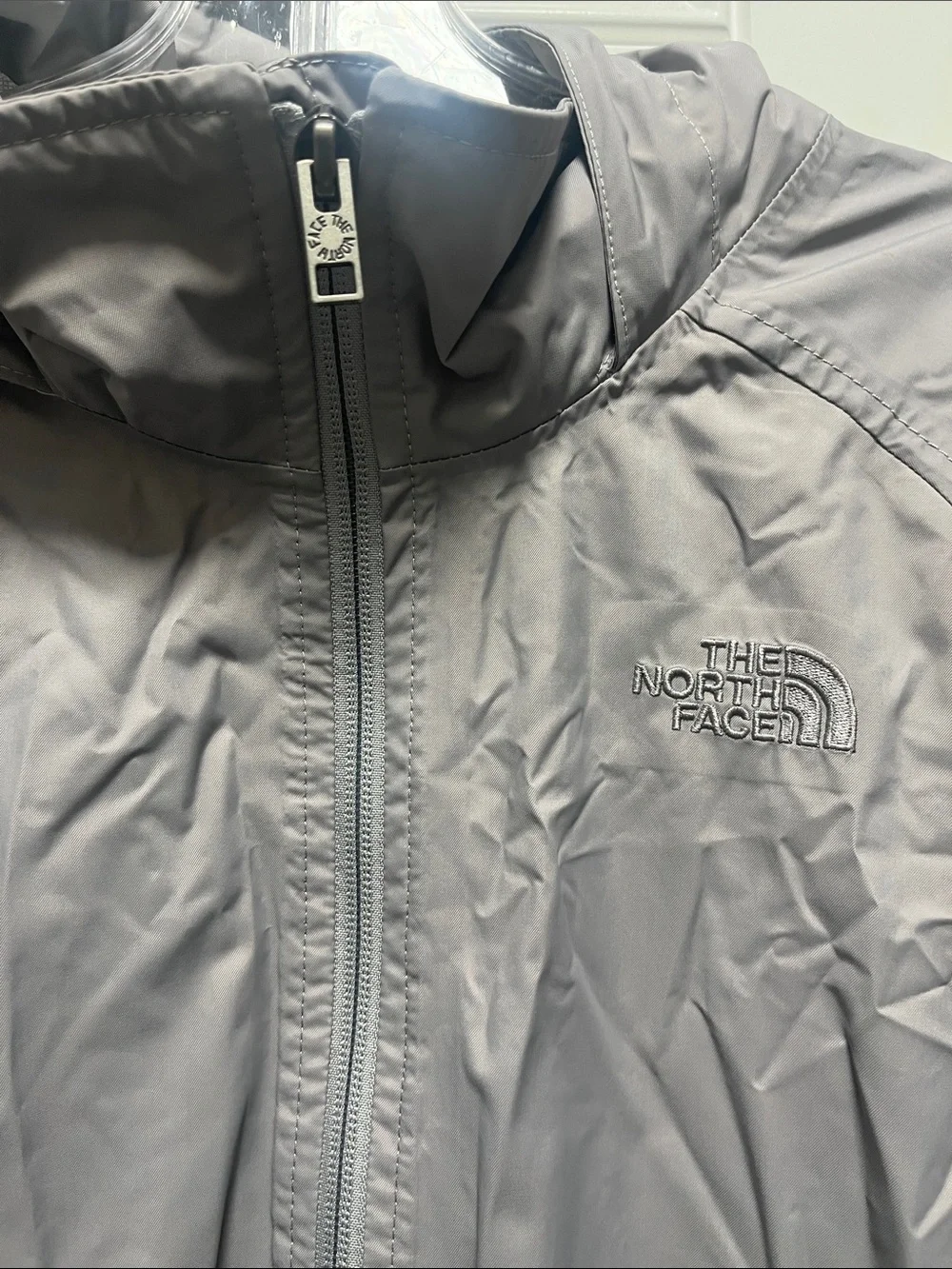 The North Face Light Gray women’s' Hooded Rain Jacket